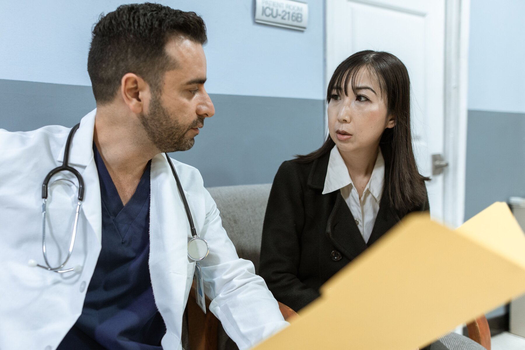 A doctor and a woman talking during a consultation